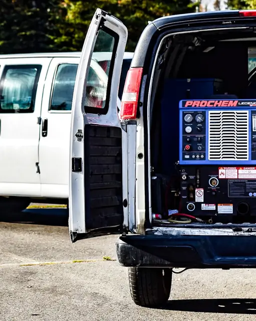 Prochem Legend truck-mount machine in the open back of the Best Deal van